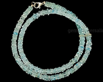 May include: A light blue aquamarine gemstone necklace with a silver clasp. The necklace is made of small, faceted beads and is approximately 18 inches long.