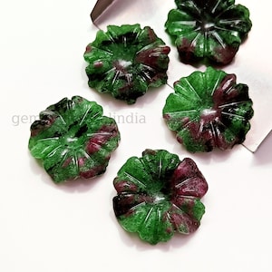 May include: Five green and pink gemstone flower cabochons. The cabochons are carved in a flower shape with a raised centre. The gemstones are a mix of green and pink.