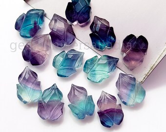Puede incluir: Surtido de 14 piedras preciosas de fluorita talladas en tonos de azul, verde y morado. Cada piedra preciosa tiene forma de hoja y un patrón único.