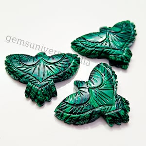 May include: Three green malachite gemstone carvings of birds. Each bird is intricately carved with detailed feathers and a wingspan of approximately 2 inches.
