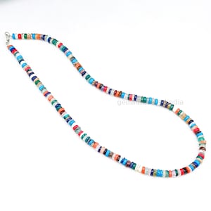 May include: A colorful beaded necklace with a variety of stones, including turquoise, red coral, and lapis lazuli.