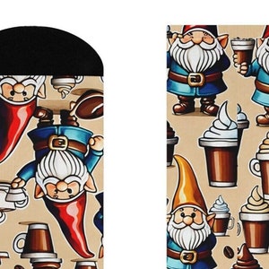 May include: A pair of socks with a whimsical design featuring gnomes, coffee cups, and coffee beans on a beige background. The gnomes are wearing blue pants and red hats. The coffee cups are filled with a brown liquid and topped with whipped cream.