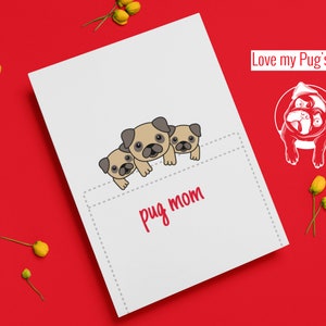 May include: A white card with a cute illustration of three pugs peeking out of a pocket. The text "pug mom" is written below the pugs. The card has a red background and the text "Love my Pug's Mug!" is written in red at the top.