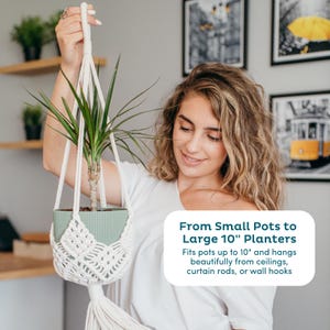 May include: A white macrame plant hanger holding a green pot with a green plant. The text on the image says, "From Small Pots to Large 10" Planters. Fits pots up to 10" and hangs beautifully from ceilings, curtain rods, or wall hooks."