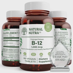 May include: Three amber plastic bottles of Natural Nutra B-12 1,000 mcg dietary supplement tablets with white caps. The front label features a tree logo, text stating 60 vegan tablets, and a clear crystal award with Natural Products Association text.