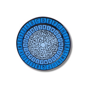 May include: A blue and black circular metal pin with a maze design and the alphabet printed around the edge.