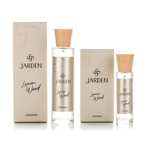 May include: Three bottles of JARDEN Lemon Wood cologne. The bottles are different sizes and have a wooden cap. The cologne is a light yellow color.