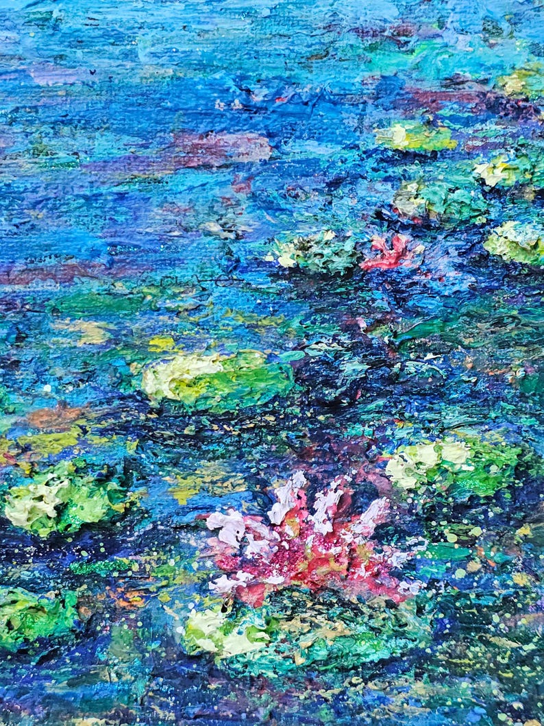 May include: An abstract painting of a water scene with blue, green, and pink hues. The artwork depicts water lilies and their reflections, with textured brushstrokes creating depth and movement. The colors blend to evoke a sense of tranquility.