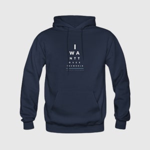 May include: Navy blue hooded sweatshirt with white text that reads "I WANT TO SEE THE WORLD" in an eye chart style.