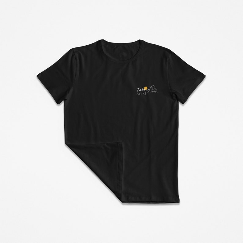 May include: Black t-shirt with a white graphic of a mountain range and a sun with the text "Take a Hike" on the front.