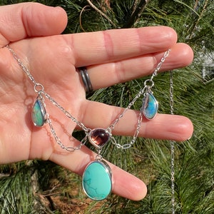 Tourmaline, turquoise, and boulder pipe opal festoon necklace in sterling and fine silver.