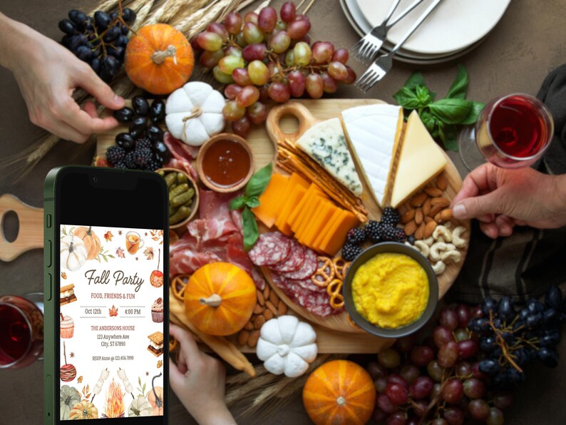 May include: A fall party spread with a variety of foods, including cheese, grapes, and pumpkins. A smartphone displays a party invitation with the text "Fall Party". The invitation includes the date, time, and location.