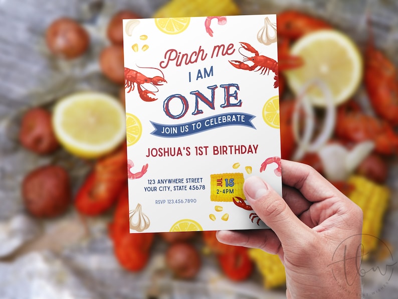 May include: A colourful invitation for a first birthday party with a crawfish boil theme. The invitation features a red crawfish, lemons, corn, garlic, and the text "Pinch me I am ONE. Join us to celebrate Joshua's 1st Birthday. July 15, 2-4PM."