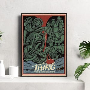 May include: A vintage-style poster for the 1982 horror film "The Thing". The poster features a green, monstrous creature with sharp teeth and a red, bloody handprint. The text on the poster reads "The Thing: Anytime. Anywhere. Anyone."