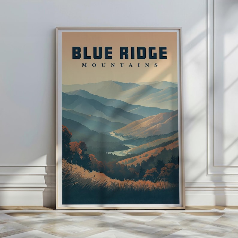 May include: A framed art print depicting the Blue Ridge Mountains. The image shows layers of blue and brown mountain ranges beneath an orange sky. The words "BLUE RIDGE MOUNTAINS" are printed at the top of the artwork.