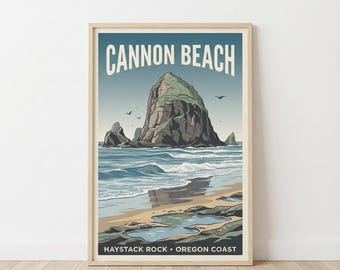 May include: A framed art print featuring a coastal scene of Cannon Beach, Oregon. The artwork depicts Haystack Rock, a large rock formation in the ocean, with text that reads "CANNON BEACH" and "HAYSTACK ROCK • OREGON COAST". The color palette includes blues, greens, and beige.