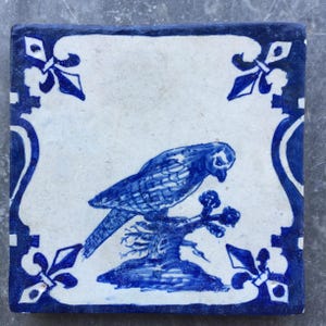 Antique 17th century Dutch Delft tile with bird on a branch