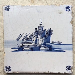Antique 17th century Dutch Delft tile with a castle