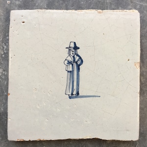 Antique Dutch Delft tile with a man