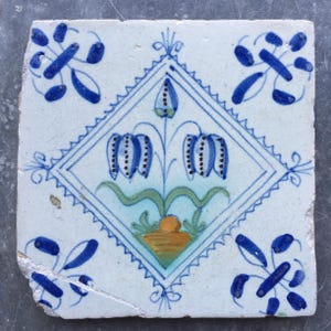 Antique Dutch Delft tile with tulips