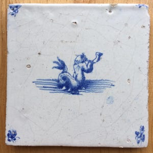 Antique 17th century Dutch Delft tile with a Merman blowing a horn