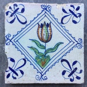 Antique Dutch Delft tile with a tulip