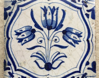 Antique Dutch Delft tile with decoration of tulips