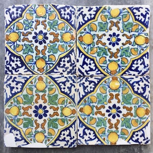 Antique 17th century Dutch Delft tiles with the decoration of pomegranates