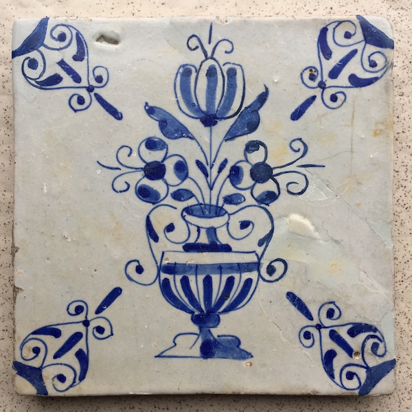Antique 17th century blue and white Dutch Delft tile with flower vase