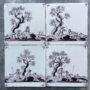 Antique 17th century Dutch Delft tiles with the decoration of love scenes