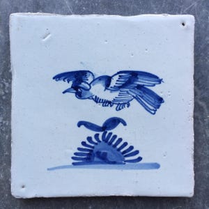 Antique 17th century Dutch Delft tile with bird in flight