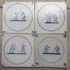 Antique 19th century Dutch Delft tiles with child&#39;s plays.