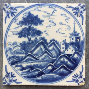 Antique Dutch Delft landscape tile with church landscape