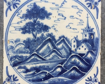 Antique Dutch Delft landscape tile with church landscape