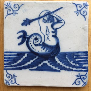 Antique 18th century Dutch Delft tile with merman sea creature