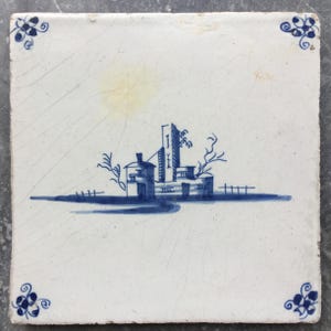 Antique Dutch Delft landscape tile with castle landscape