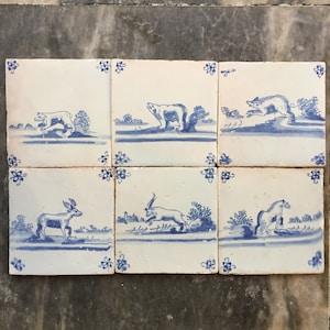 A rare set of 6 Antique Dutch Delft tiles with animals
