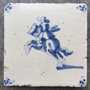 Antique Dutch Delft tile with gentleman riding a horse