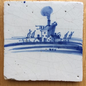 Antique 17th century Dutch Delft tile with a landscape