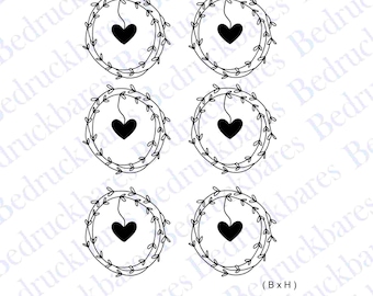 May include: Six black and white illustrations of wreaths with a heart hanging from each wreath. The wreaths are made of leaves and the hearts are simple outlines. The text (BxH) 40mm x 41mm is at the bottom of the image.