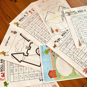 Op de afbeelding: Een set printbare story map- en dobbelspeltemplates voor kinderen. De templates hebben verschillende thema's, waaronder een oceaan-, kasteel-, boerderij- en sneeuwverhaal. Elke template bevat een story map met secties voor begin, midden en einde, evenals een dobbelspel met verschillende personages en instellingen.