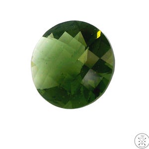 May include: A faceted, round gemstone with a deep green hue. The gem's surface reflects light, showcasing its multiple facets. The stone is set against a plain white background, highlighting its color and cut.