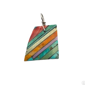 May include: A colorful pendant with a geometric design. The pendant features a variety of colors, including red, orange, green, and purple, arranged in diagonal stripes. The pendant is made of a stone-like material and has a silver-colored wire loop at the top.