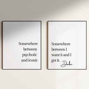 May include: Two black framed prints with white backgrounds and black text. The left print reads "Somewhere between psychotic and iconic". The right print reads "Somewhere between I want it and I got it. -Drake"