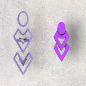 May include: Two lavender-colored geometric earrings. One earring is a single piece with an oval top and three diamond shapes below. The other earring is a single piece with an oval top and two diamond shapes below. The earrings are on a gray background.