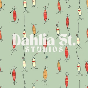 May include: A green background with a repeating pattern of red, orange, and yellow fishing lures. The text "Dahlia St. Studios" is in the center of the image.