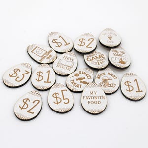 May include: Wooden egg-shaped tokens with different dollar amounts and phrases like "Sweet Treat", "Movie Night", and "Board Game Night".