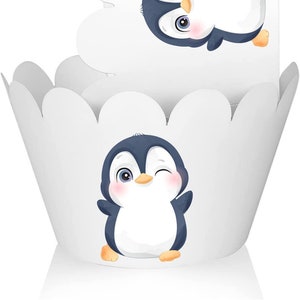 May include: White cupcake liners with a cute penguin design. The penguin is wearing a blue and white hat and has a pink blush on its cheeks. The penguin is winking.