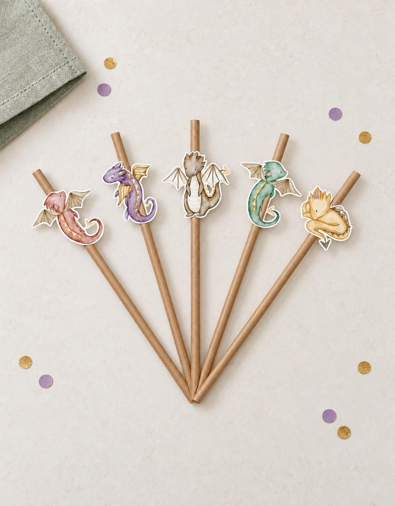 May include: Five brown paper straws arranged in a fan shape, each featuring a unique dragon cutout. The dragons are illustrated in red, purple, brown, green, and yellow, each with small wings and a tail, attached to the upper portion of the straws.