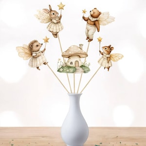 May include: A white vase holds whimsical fairy-themed decorations. The decorations include a mushroom house and several woodland creatures with wings, holding star wands. The creatures are a rabbit, bear, hedgehog, and squirrel, all dressed in vintage-style clothing.
